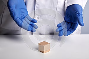 Doctor Shows Clean Wooden Cube - Labs Photo