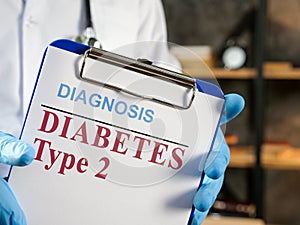 Doctor shows diabetes type 2 diagnosis in the medical form.