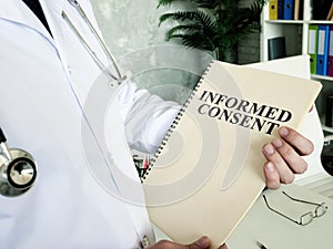 Doctor shows documents and informed consent form.