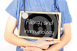 Doctor shows information on blackboard: allergy and immunology.  Medical concept