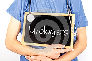 Doctor shows information on blackboard: urologists.  Medical concept