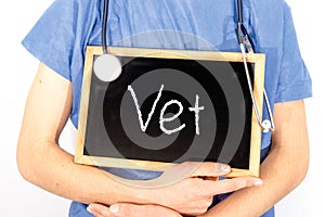 Doctor shows information on blackboard: vet.  Medical concept