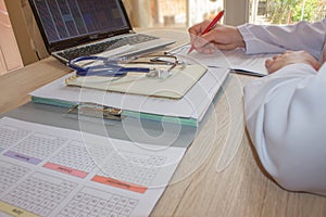 Doctor sitting at the desk near window. Medicine doctor`s workin