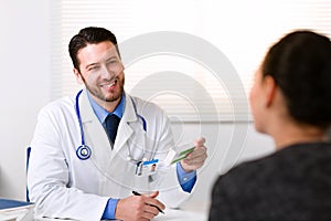 Doctor smiling looking at patient