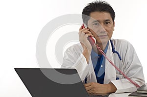 Doctor speaking with patient on the telephone