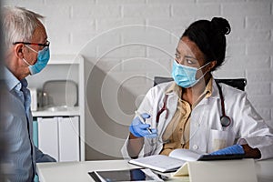 Doctor specialist consulting a patient in a doctor's office at a clinic