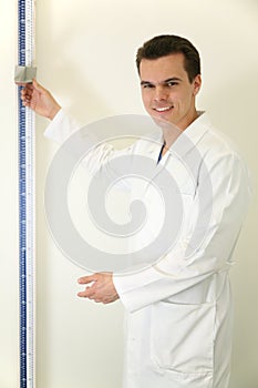 Doctor with stadiometer photo
