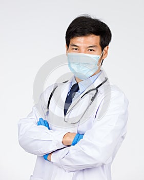 Doctor standing arm crossed on white background