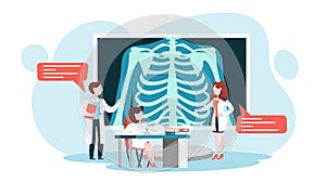 Doctor standing around a big x-ray image of chest