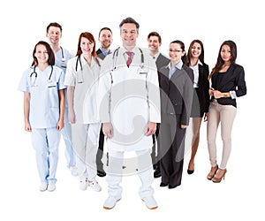 Doctor standing in front of his team