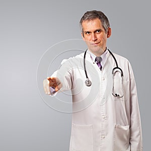 doctor standing and gesturing with copy spaace