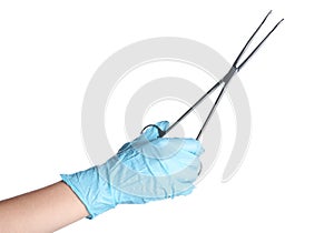 Doctor in sterile glove holding medical forceps