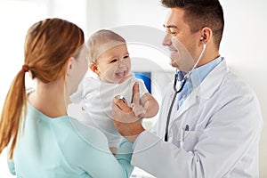 Doctor with stethoscope and baby at clinic