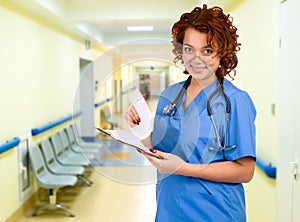 Doctor with stethoscope in corridor