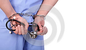 Doctor with stethoscope in handcuffs isolated