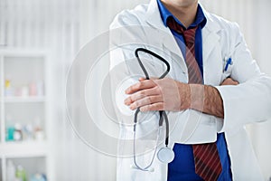 Doctor with stethoscope in hands