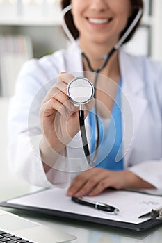 Doctor with a stethoscope in the hands, close up. Physician ready to examine and help patient. Medicine, healthcare and