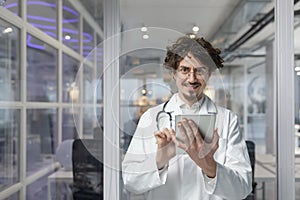 Doctor With Stethoscope Holds Tablet for Medical Consultation