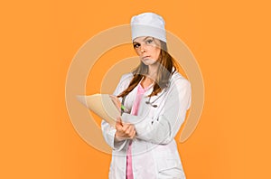 Doctor with stethoscope at hospital. Girl with folder. Medical documents. Nurse hold patient medical chart. Information