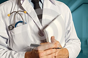 Doctor With Stethoscope Keeps Medical Journal. Healthcare Medicine Concept