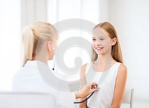 Doctor with stethoscope listening to the patient