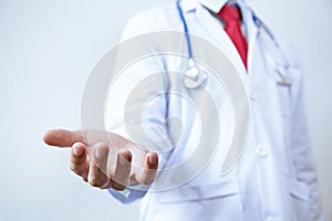 Doctor with stethoscope offering helping hands gesture