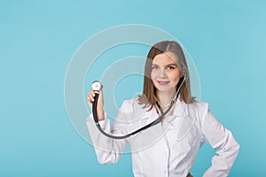 Doctor with stethoscope over blue background