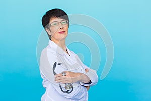 Doctor with stethoscope over blue background with copy space