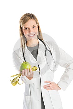 Doctor With Stethoscope Showing Green Apple And Tape Measure