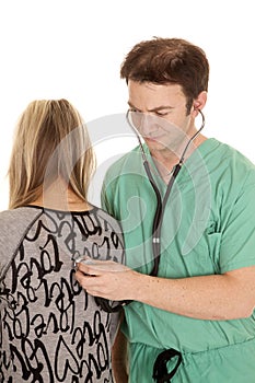 Doctor with stethoscope on womans back