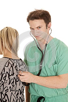 Doctor with stethoscope on womans back looking