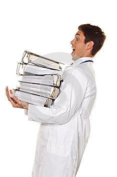 Doctor on stress with stacks of files. Bureaucracy