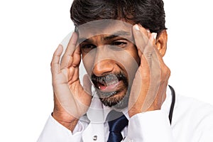 Doctor suffering headache close-up