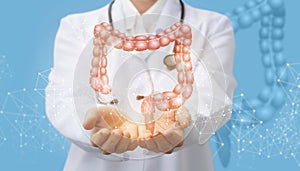 Doctor supports the colon of a person . photo