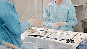 Doctor surgeon disinfects and washing his hands in gloves before medical surgical intervention. disinfection. Surgery