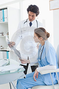 Doctor and surgeon looking at an x ray