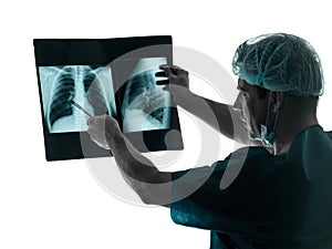 Doctor surgeon radiologist examining lung torso x-ray image