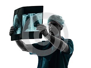 Doctor surgeon radiologist examining lung torso x-ray image