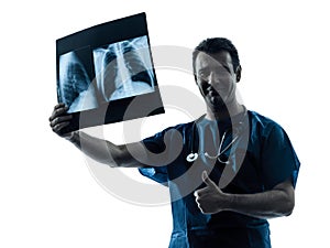 Doctor surgeon radiologist examining lung torso x-ray image thu