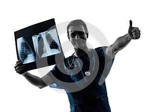 Doctor surgeon radiologist examining x-ray image