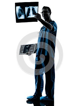 Doctor surgeon radiologist examining x-ray image