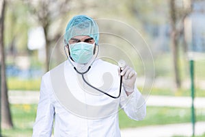 Doctor With Surgical Mask and Gloves Outside