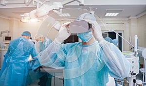 Doctor in a surgical room with virtual reality glasses on the background