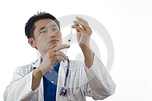 Doctor with syringe and medical vial