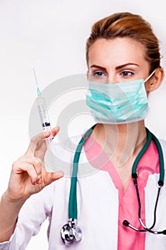 Doctor with syringe and stethoscope