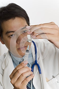 Doctor with syringe and vaccine