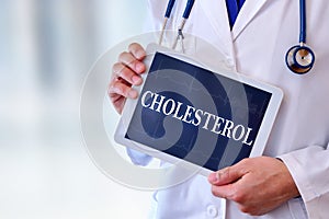 Doctor with tablet with cholesterol message