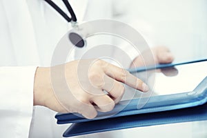 Doctor with tablet computer