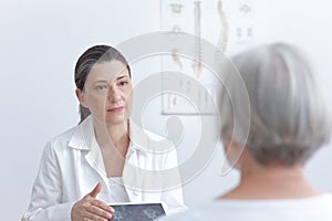 Doctor tablet computer senior patient