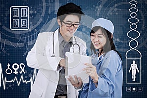 Doctor with tablet and futuristic interface background